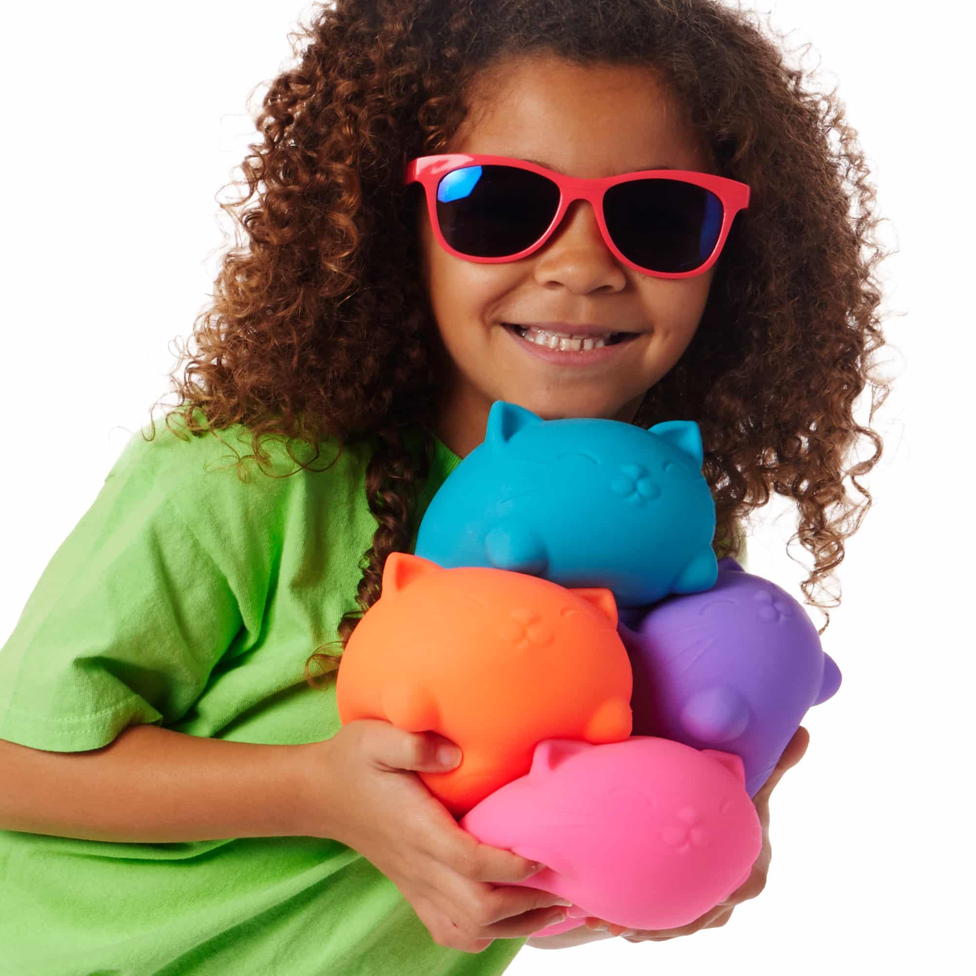 NeeDoh Super Cool Cats Q2 - Lifestyle with girl holding all four colors Super Cool Cats Q2
