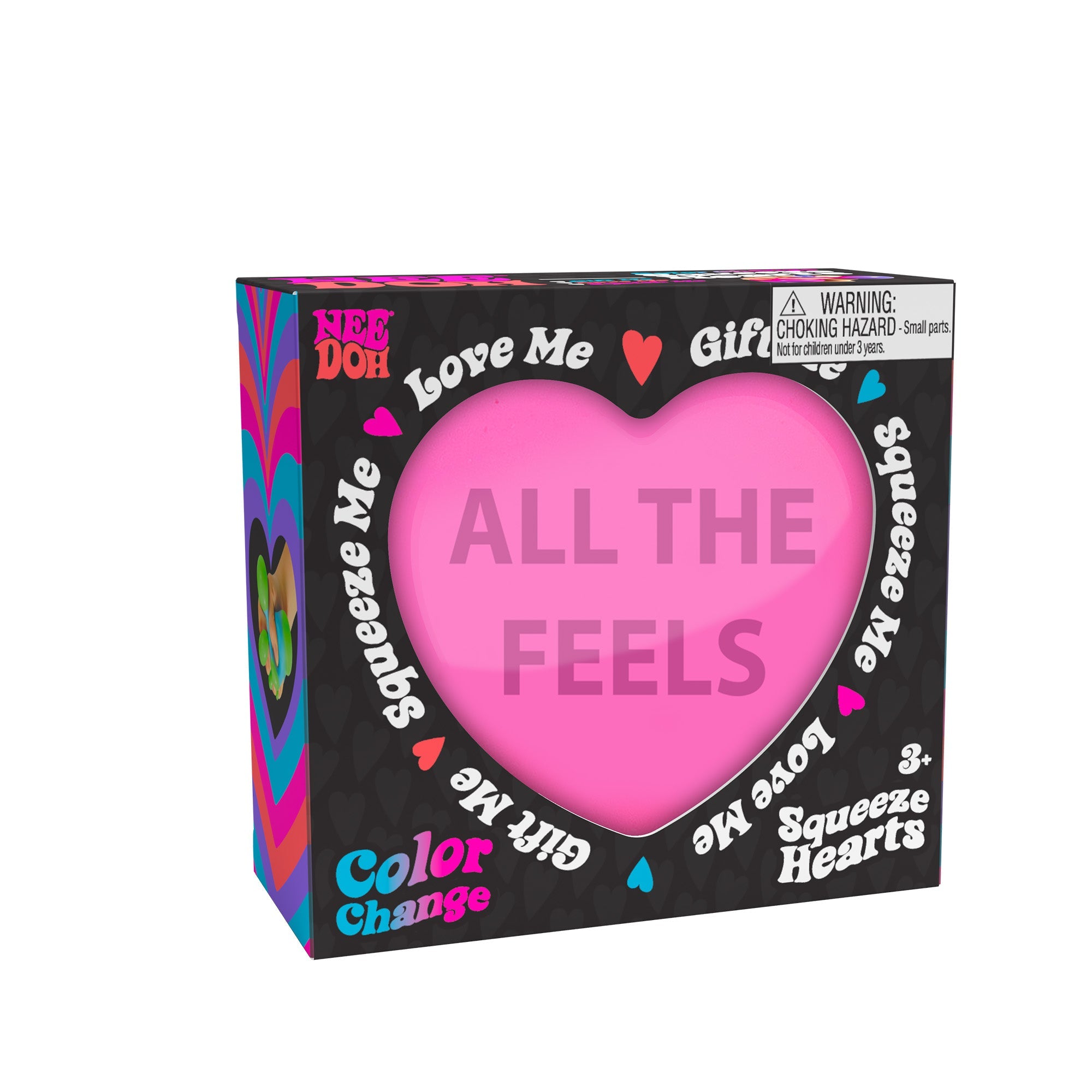 A boxed Nee Doh Color Change Squeeze Heart R2 toy. The packaging is predominantly black with colorful accents, featuring phrases like "ALL THE FEELS," "Squeeze Me," "Love Me," and "Gift Me." The box also includes a choking hazard warning for small parts.