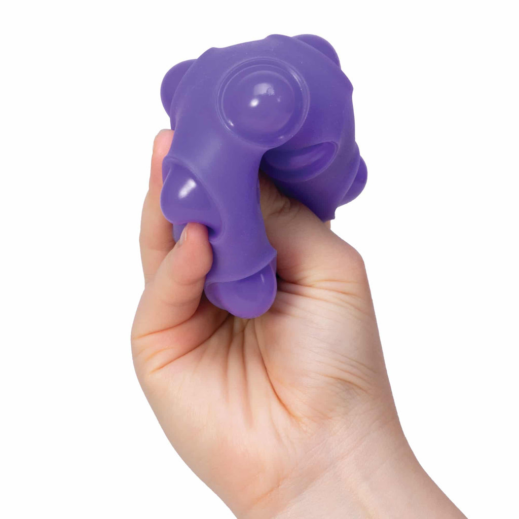 NeeDoh Happy Snappy W2 - Hand squeezing purple Happy Snappy W2