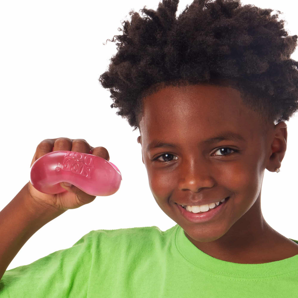 NeeDoh Nice Cube X7 Lifestyle of boy squeezing pink Nice Cube X7