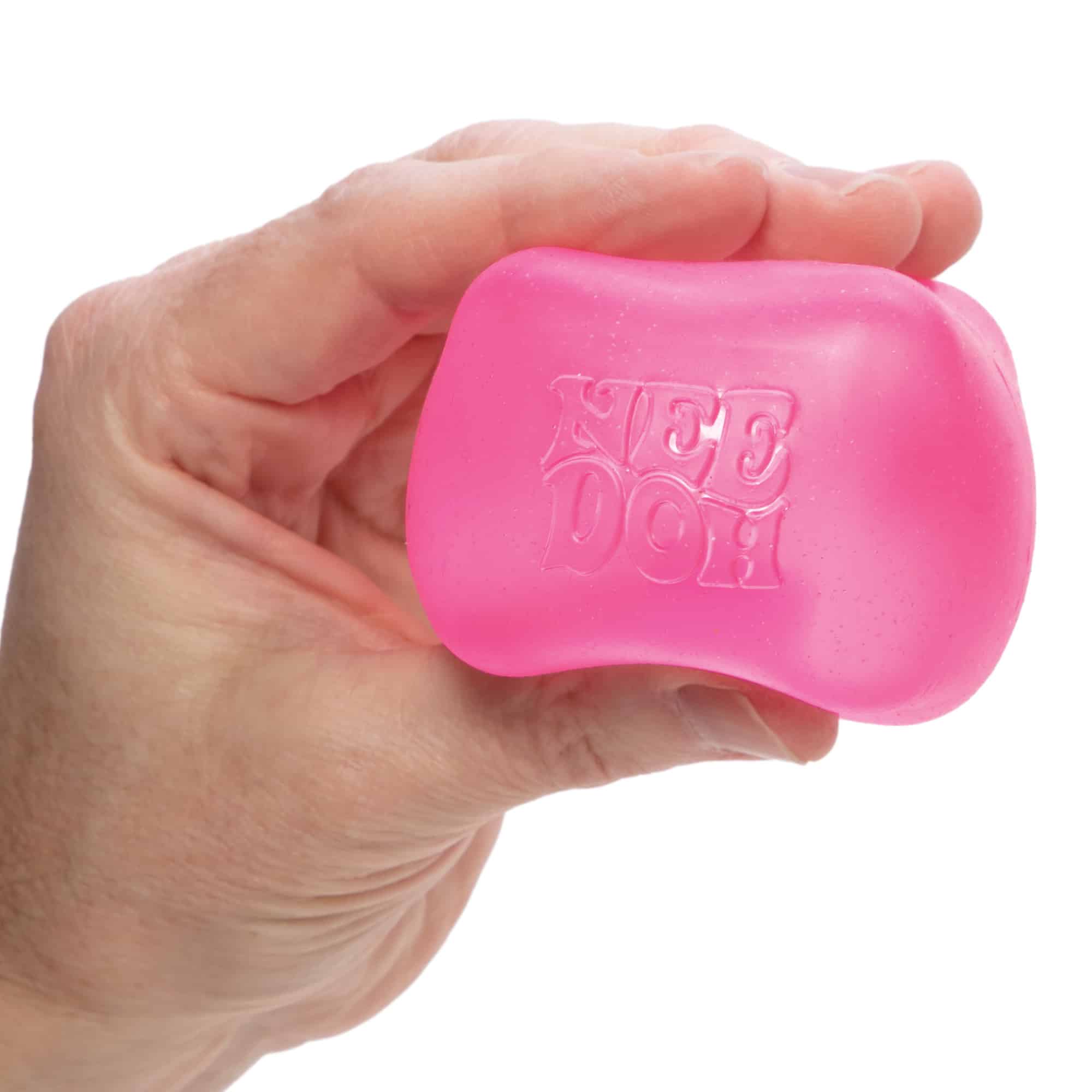 NeeDoh Nice Cube X7 Pink Held in Hand