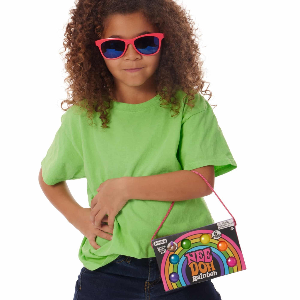 Girl wearing neon sunglasses with NeeDoh Rainboh V1 package hanging off her arm